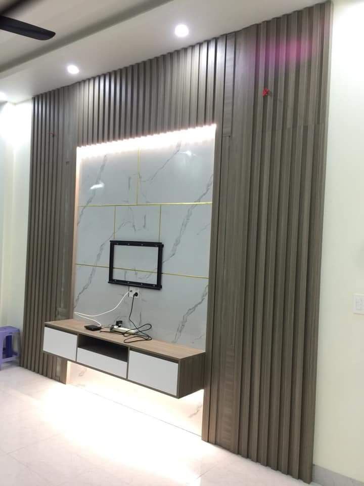 Décoration du mur du salon avec du bardage et HPL + Meuble tv